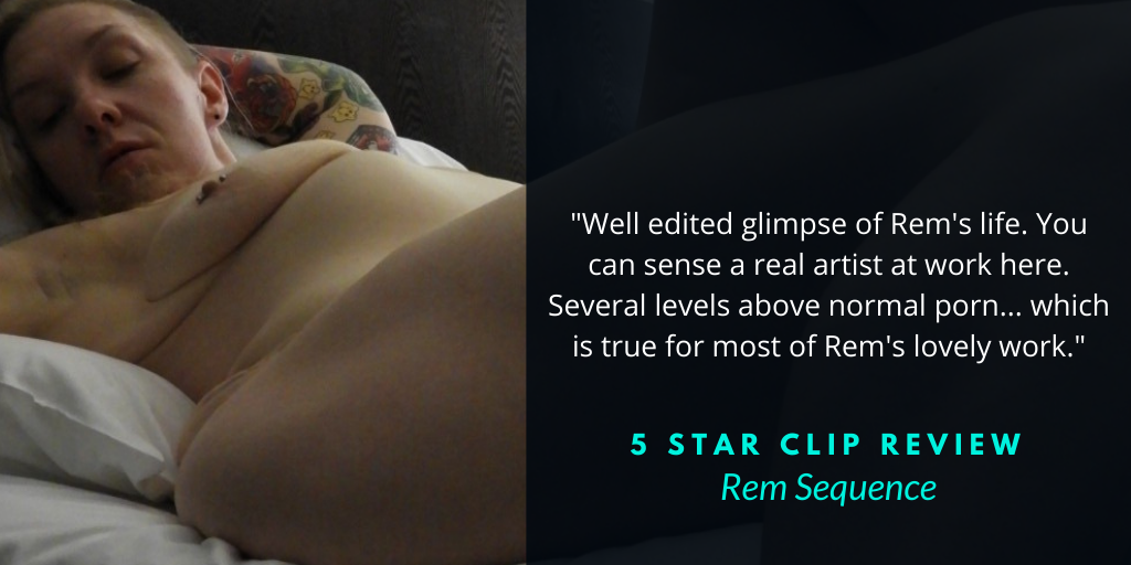 Rem Sequence Aussie alternative adult model clip review on an image of Rem reclining on a bed naked with tattooed arm sleeves